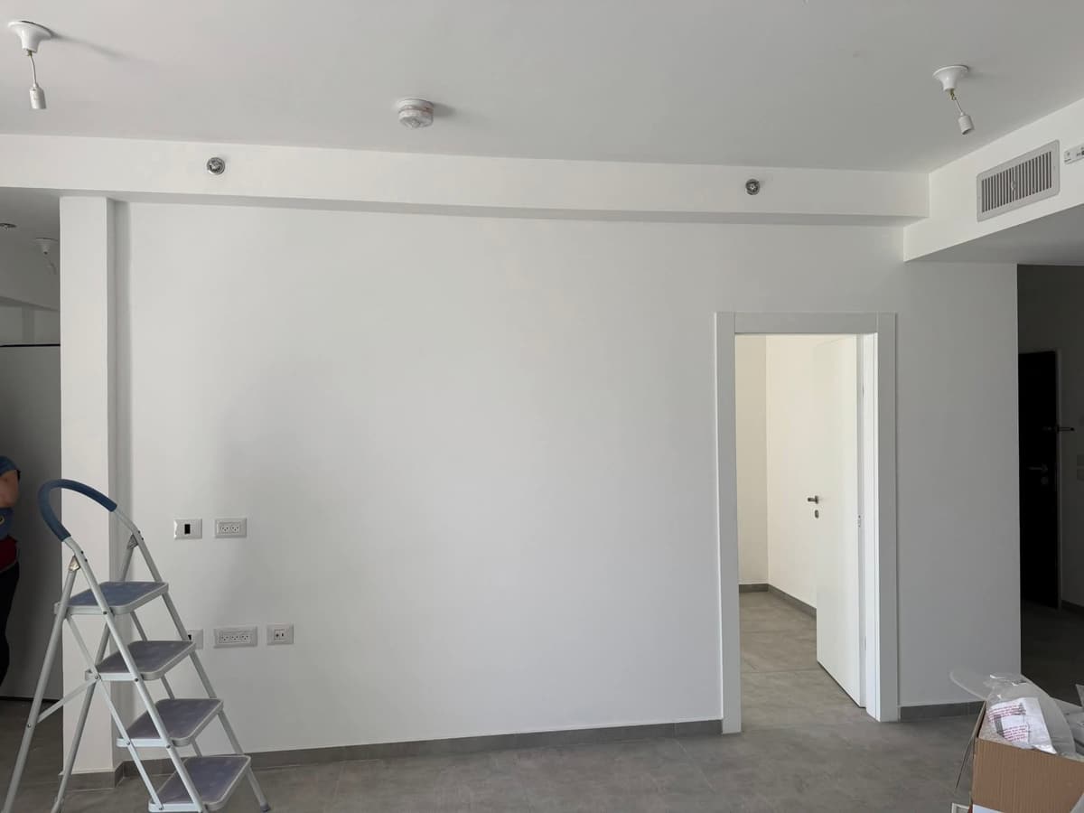 White wall with a doorway before painting