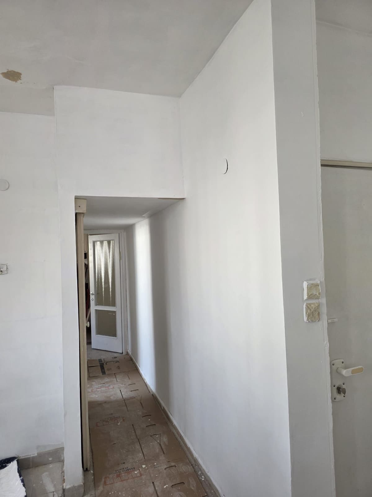 The hallway finished in white