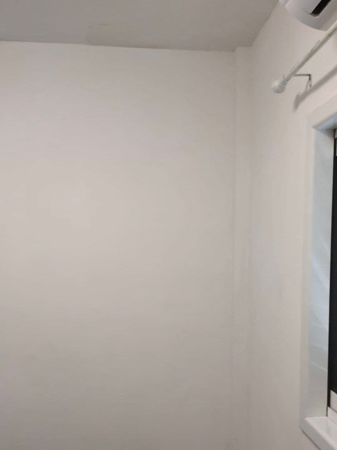 The same corner, clean and freshly painted white