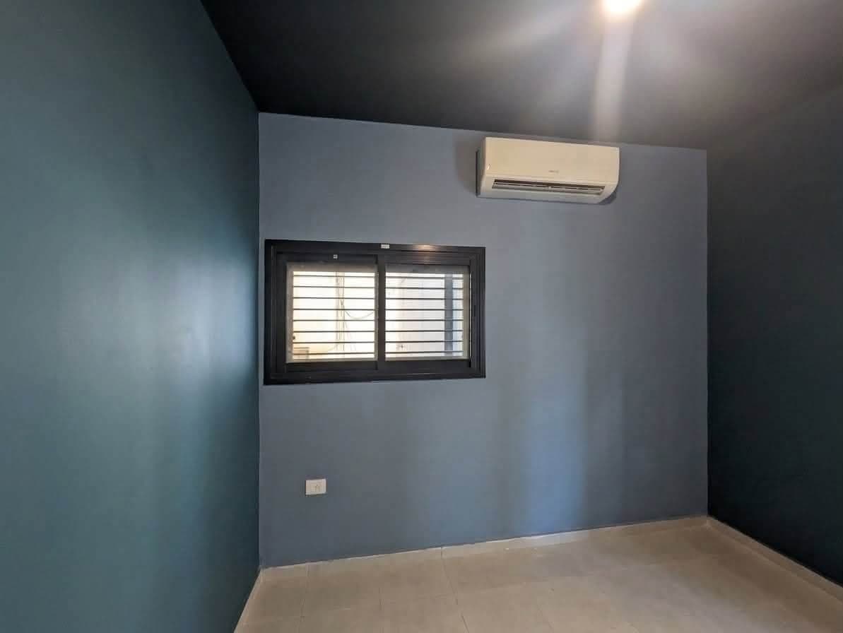 Finished room with dark teal walls and ceiling