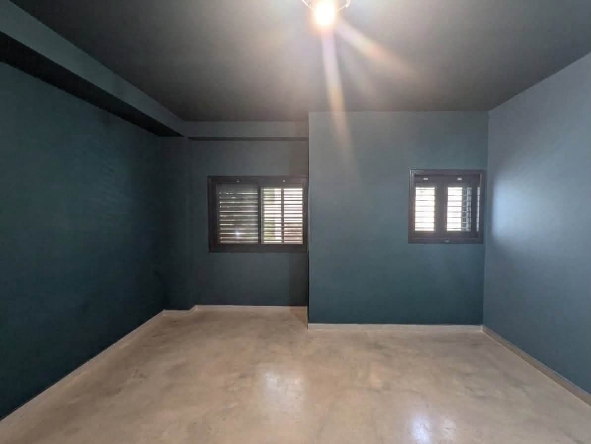 The finished teal room seen from the doorway