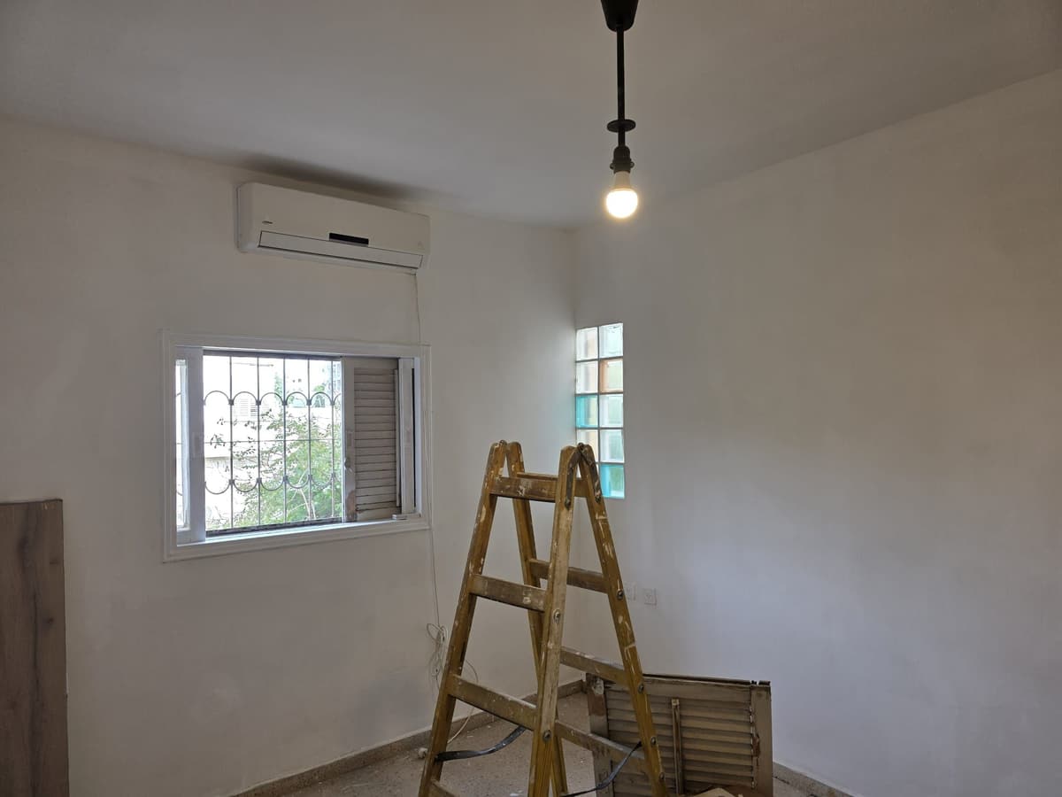The same bedroom painted white